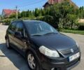 Черный Сузуки СХ4, объемом двигателя 1.6 л и пробегом 230 тыс. км за 5000 $, фото 1 на Automoto.ua