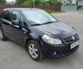 Черный Сузуки СХ4, объемом двигателя 1.6 л и пробегом 249 тыс. км за 6400 $, фото 2 на Automoto.ua