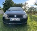 Черный Сузуки СХ4, объемом двигателя 1.6 л и пробегом 117 тыс. км за 4600 $, фото 1 на Automoto.ua