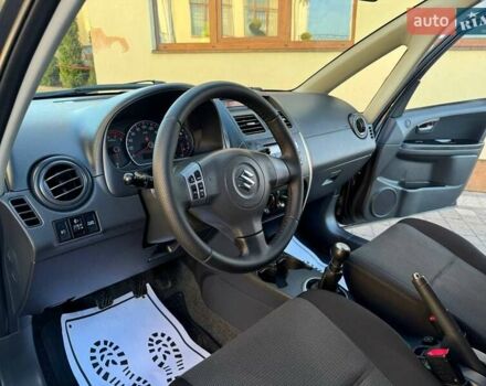 Чорний Сузукі СХ4, об'ємом двигуна 1.59 л та пробігом 240 тис. км за 5100 $, фото 13 на Automoto.ua