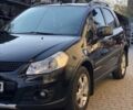 Черный Сузуки СХ4, объемом двигателя 1.6 л и пробегом 140 тыс. км за 9600 $, фото 1 на Automoto.ua
