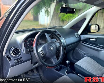 Черный Сузуки СХ4, объемом двигателя 1.6 л и пробегом 204 тыс. км за 5800 $, фото 4 на Automoto.ua