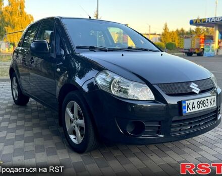 Черный Сузуки СХ4, объемом двигателя 1.6 л и пробегом 204 тыс. км за 5800 $, фото 1 на Automoto.ua
