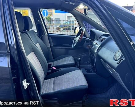 Черный Сузуки СХ4, объемом двигателя 1.6 л и пробегом 204 тыс. км за 5800 $, фото 5 на Automoto.ua