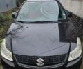 Черный Сузуки СХ4, объемом двигателя 1.6 л и пробегом 130 тыс. км за 7300 $, фото 1 на Automoto.ua