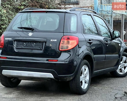 Черный Сузуки СХ4, объемом двигателя 1.59 л и пробегом 143 тыс. км за 8999 $, фото 2 на Automoto.ua
