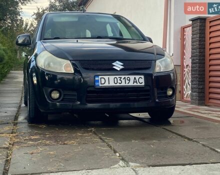 Черный Сузуки СХ4, объемом двигателя 1.9 л и пробегом 220 тыс. км за 5700 $, фото 1 на Automoto.ua