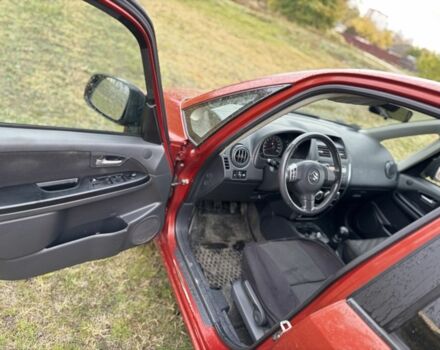 Красный Сузуки СХ4, объемом двигателя 1.6 л и пробегом 235 тыс. км за 3200 $, фото 8 на Automoto.ua