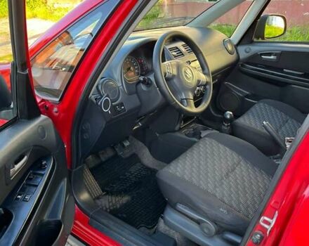 Красный Сузуки СХ4, объемом двигателя 1.6 л и пробегом 233 тыс. км за 5300 $, фото 13 на Automoto.ua