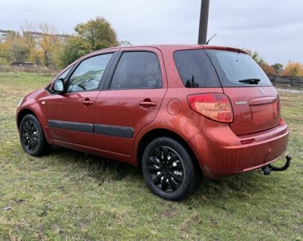 Красный Сузуки СХ4, объемом двигателя 1.6 л и пробегом 235 тыс. км за 3200 $, фото 2 на Automoto.ua