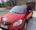 Красный Сузуки СХ4, объемом двигателя 1.6 л и пробегом 156 тыс. км за 5600 $, фото 1 на Automoto.ua