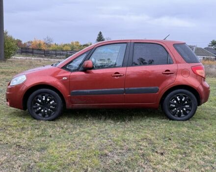 Красный Сузуки СХ4, объемом двигателя 1.6 л и пробегом 235 тыс. км за 3200 $, фото 1 на Automoto.ua