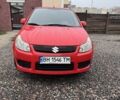 Красный Сузуки СХ4, объемом двигателя 1.6 л и пробегом 183 тыс. км за 6700 $, фото 1 на Automoto.ua