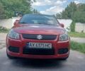 Красный Сузуки СХ4, объемом двигателя 1.6 л и пробегом 222 тыс. км за 7000 $, фото 1 на Automoto.ua