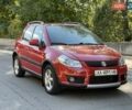 Красный Сузуки СХ4, объемом двигателя 1.6 л и пробегом 145 тыс. км за 7600 $, фото 1 на Automoto.ua