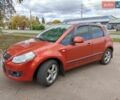 Красный Сузуки СХ4, объемом двигателя 1.6 л и пробегом 112 тыс. км за 4700 $, фото 1 на Automoto.ua