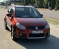 Красный Сузуки СХ4, объемом двигателя 1.6 л и пробегом 203 тыс. км за 6925 $, фото 1 на Automoto.ua