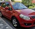 Красный Сузуки СХ4, объемом двигателя 1.59 л и пробегом 149 тыс. км за 7000 $, фото 1 на Automoto.ua
