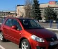 Красный Сузуки СХ4, объемом двигателя 1.6 л и пробегом 218 тыс. км за 6500 $, фото 1 на Automoto.ua