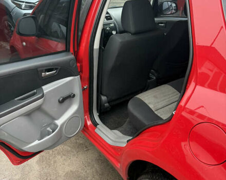 Красный Сузуки СХ4, объемом двигателя 1.59 л и пробегом 200 тыс. км за 5500 $, фото 7 на Automoto.ua