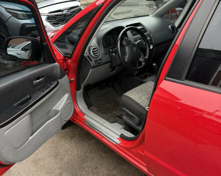 Красный Сузуки СХ4, объемом двигателя 1.59 л и пробегом 200 тыс. км за 5500 $, фото 4 на Automoto.ua