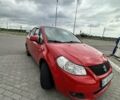Красный Сузуки СХ4, объемом двигателя 1.6 л и пробегом 405 тыс. км за 3600 $, фото 1 на Automoto.ua