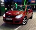 Красный Сузуки СХ4, объемом двигателя 1.59 л и пробегом 253 тыс. км за 6500 $, фото 1 на Automoto.ua