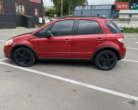 Красный Сузуки СХ4, объемом двигателя 2 л и пробегом 315 тыс. км за 8500 $, фото 1 на Automoto.ua