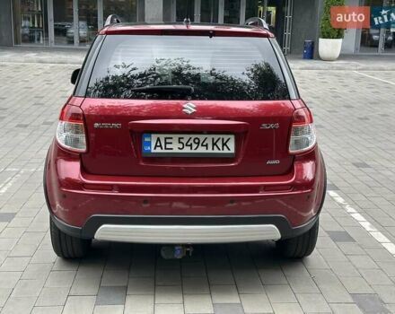 Красный Сузуки СХ4, объемом двигателя 2 л и пробегом 200 тыс. км за 9500 $, фото 4 на Automoto.ua