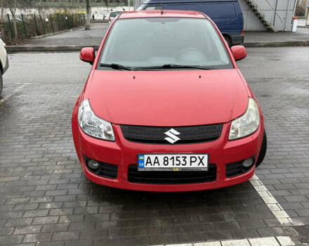 Красный Сузуки СХ4, объемом двигателя 1.59 л и пробегом 200 тыс. км за 5500 $, фото 1 на Automoto.ua