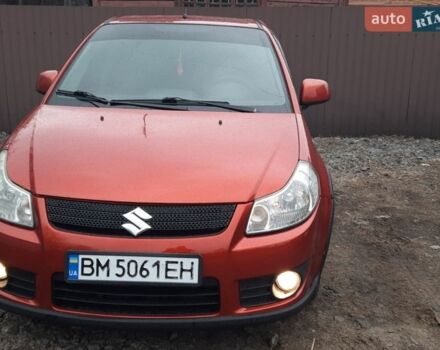 Красный Сузуки СХ4, объемом двигателя 1.59 л и пробегом 180 тыс. км за 6500 $, фото 1 на Automoto.ua