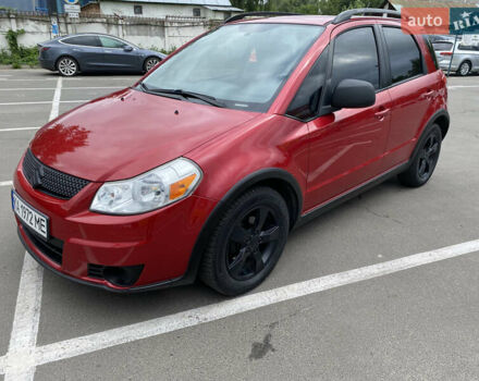 Красный Сузуки СХ4, объемом двигателя 2 л и пробегом 315 тыс. км за 8500 $, фото 1 на Automoto.ua