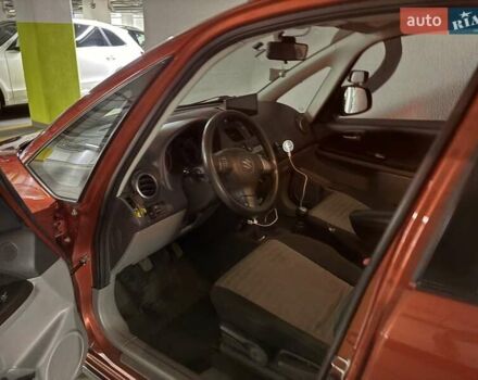 Красный Сузуки СХ4, объемом двигателя 1.6 л и пробегом 171 тыс. км за 7000 $, фото 1 на Automoto.ua