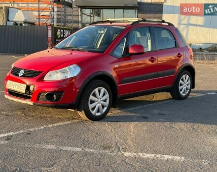 Красный Сузуки СХ4, объемом двигателя 1.59 л и пробегом 121 тыс. км за 9000 $, фото 1 на Automoto.ua