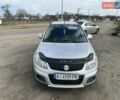 Серый Сузуки СХ4, объемом двигателя 1.6 л и пробегом 150 тыс. км за 8000 $, фото 1 на Automoto.ua