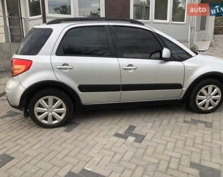 Серый Сузуки СХ4, объемом двигателя 1.59 л и пробегом 210 тыс. км за 7500 $, фото 1 на Automoto.ua