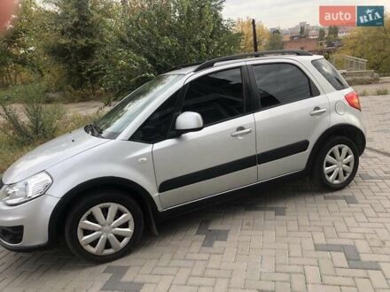 Серый Сузуки СХ4, объемом двигателя 1.59 л и пробегом 210 тыс. км за 7500 $, фото 1 на Automoto.ua