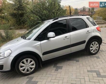 Серый Сузуки СХ4, объемом двигателя 1.59 л и пробегом 210 тыс. км за 7500 $, фото 1 на Automoto.ua