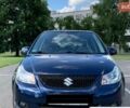 Синий Сузуки СХ4, объемом двигателя 1.6 л и пробегом 215 тыс. км за 7000 $, фото 1 на Automoto.ua
