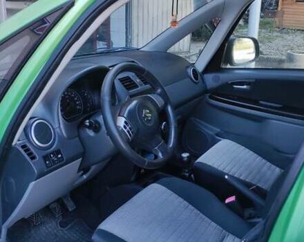 Зеленый Сузуки СХ4, объемом двигателя 1.59 л и пробегом 275 тыс. км за 4800 $, фото 14 на Automoto.ua