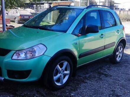 Зеленый Сузуки СХ4, объемом двигателя 1.59 л и пробегом 275 тыс. км за 4800 $, фото 1 на Automoto.ua
