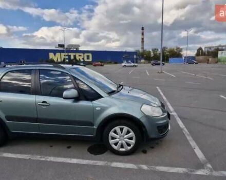 Зеленый Сузуки СХ4, объемом двигателя 1.6 л и пробегом 69 тыс. км за 11000 $, фото 1 на Automoto.ua