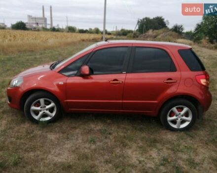 Оранжевый Сузуки СХ4, объемом двигателя 1.59 л и пробегом 202 тыс. км за 6300 $, фото 1 на Automoto.ua