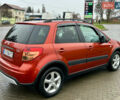 Помаранчевий Сузукі СХ4, об'ємом двигуна 1.6 л та пробігом 240 тис. км за 7500 $, фото 4 на Automoto.ua