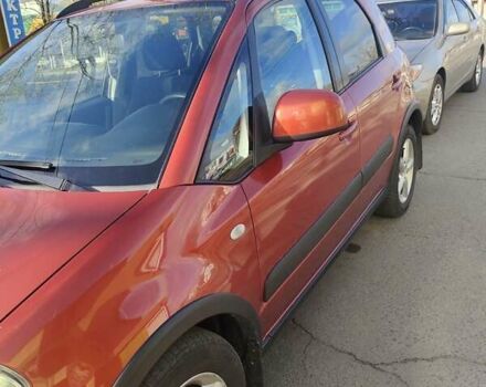 Оранжевый Сузуки СХ4, объемом двигателя 1.59 л и пробегом 172 тыс. км за 7600 $, фото 3 на Automoto.ua