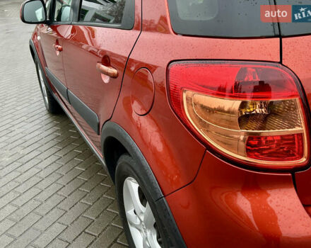 Помаранчевий Сузукі СХ4, об'ємом двигуна 1.6 л та пробігом 240 тис. км за 7500 $, фото 15 на Automoto.ua