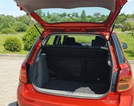 Помаранчевий Сузукі СХ4, об'ємом двигуна 1.59 л та пробігом 226 тис. км за 8000 $, фото 2 на Automoto.ua