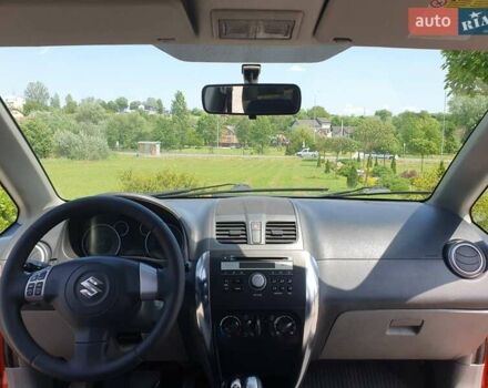 Помаранчевий Сузукі СХ4, об'ємом двигуна 1.59 л та пробігом 226 тис. км за 8000 $, фото 15 на Automoto.ua