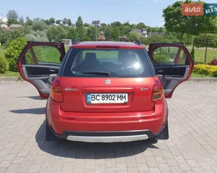 Помаранчевий Сузукі СХ4, об'ємом двигуна 1.59 л та пробігом 226 тис. км за 8000 $, фото 6 на Automoto.ua