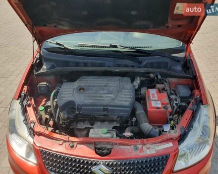 Помаранчевий Сузукі СХ4, об'ємом двигуна 1.59 л та пробігом 226 тис. км за 8000 $, фото 9 на Automoto.ua